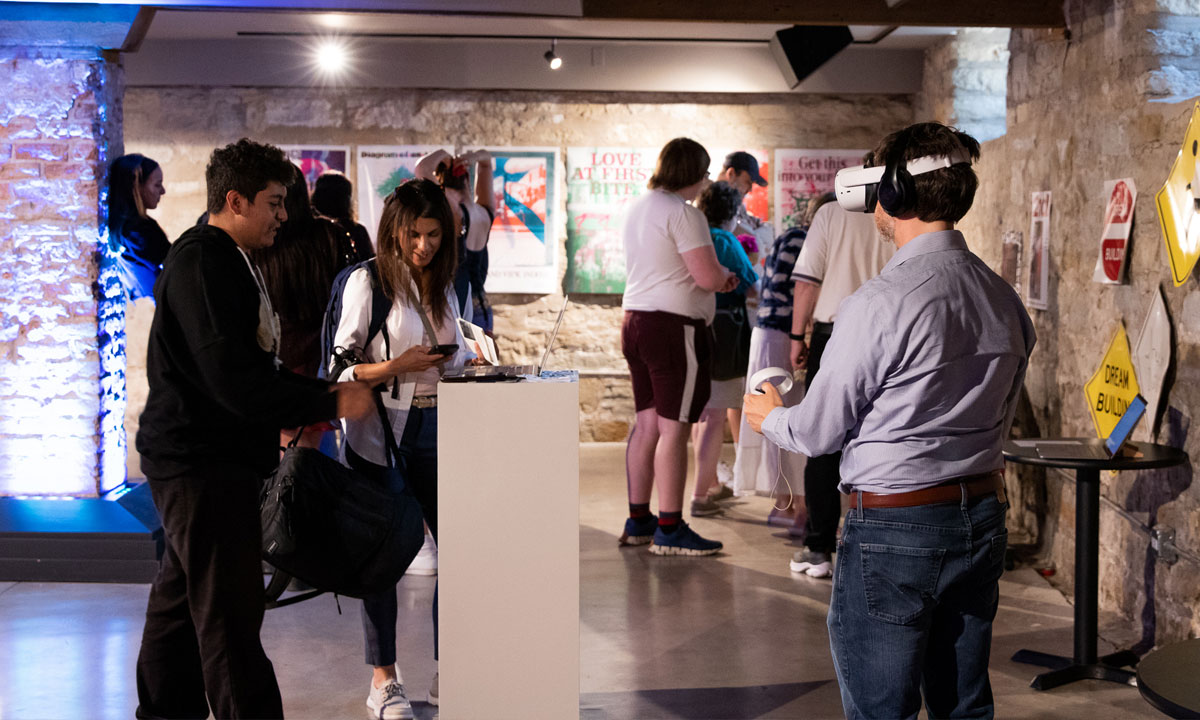art gallery looking space with people looking at art