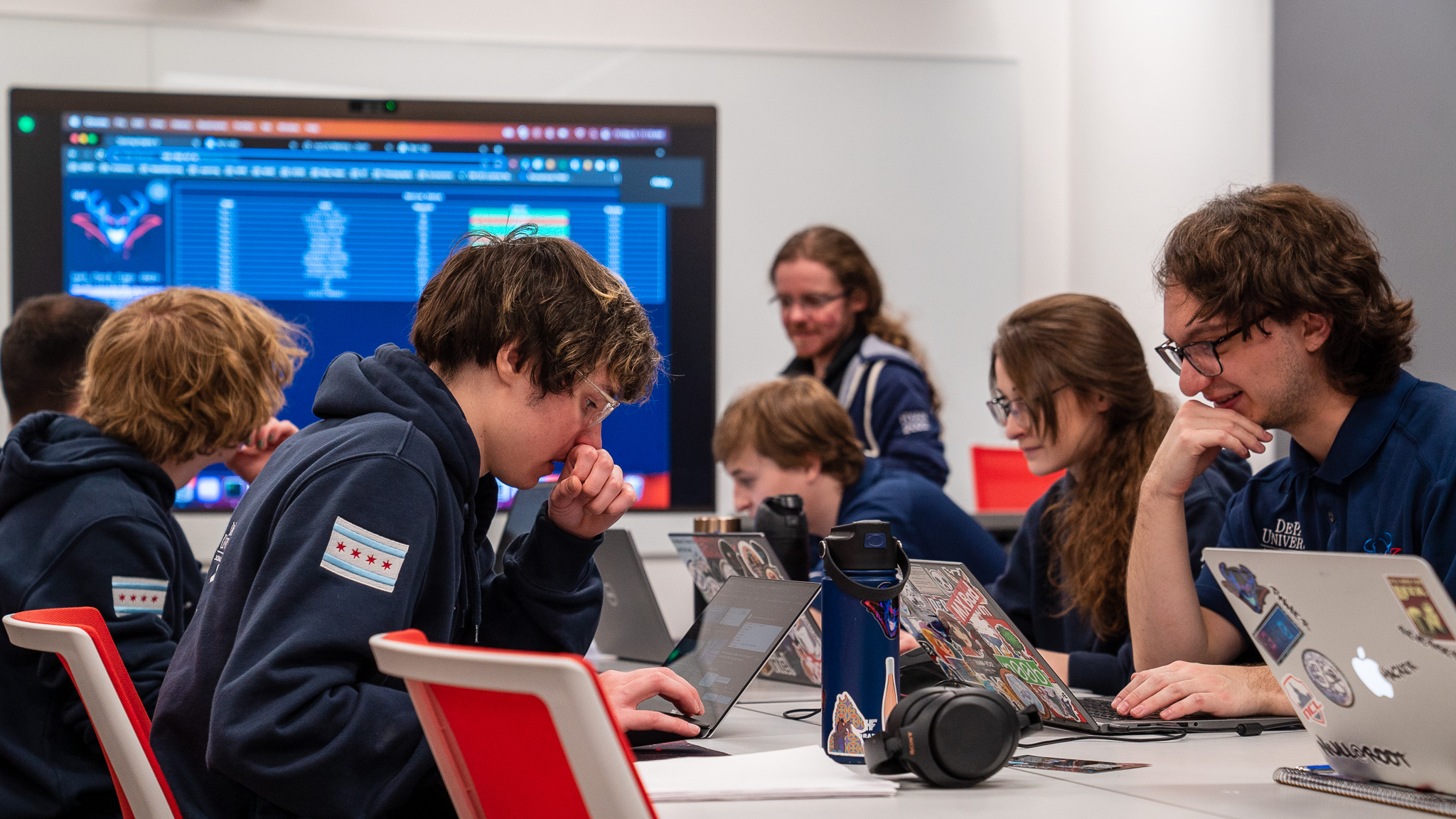 Team at table with laptops