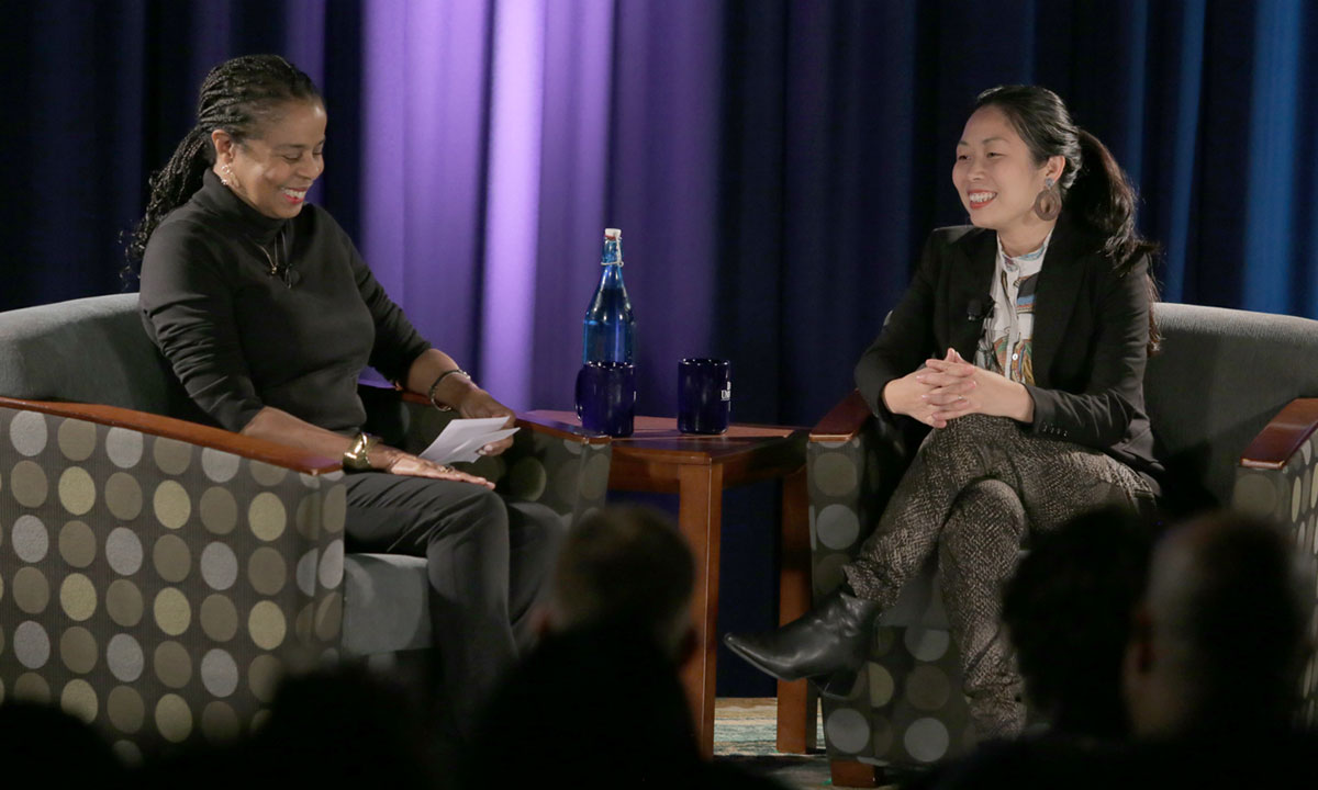 two ladies on stage conversing