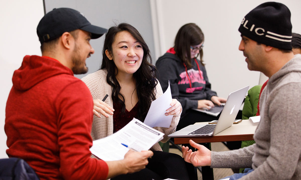 students talking at a table